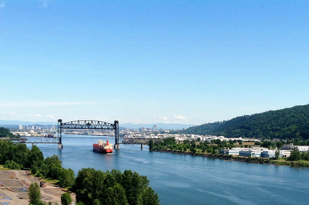 View of a ship entering Portland Harbor from a hill.