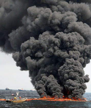 A controlled in-situ burn of surface oil after the 2010 Deepwater Horizon/BP spill in the Gulf of Mexico. (USCG)