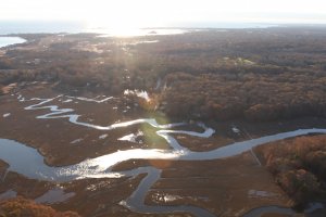 An aerial view of a meandering marsh channel at McKinney Wildlife Refuge. Credit USFWS