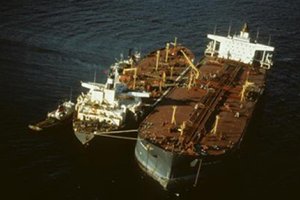 Response crews attempt to remove the remaining oil aboard the grounded tanker Exxon Valdez.