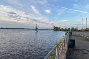 a walking path is shown next to a river