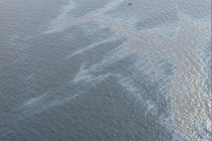Oil slick in water viewed from the air at the Taylor MC20 site.